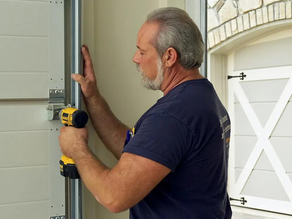 Installer adjusting a garage door track