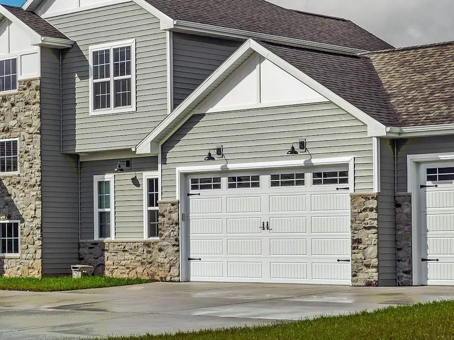 White Hörmann garage door with a row of window panels